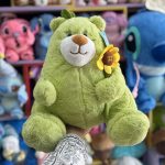 عروسک خرس سبز گل به دست