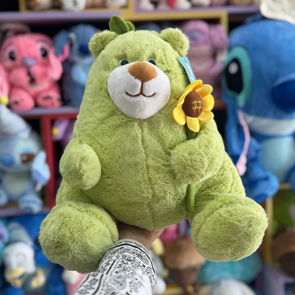 عروسک خرس سبز گل به دست عروسک خرس سبز گل به دست